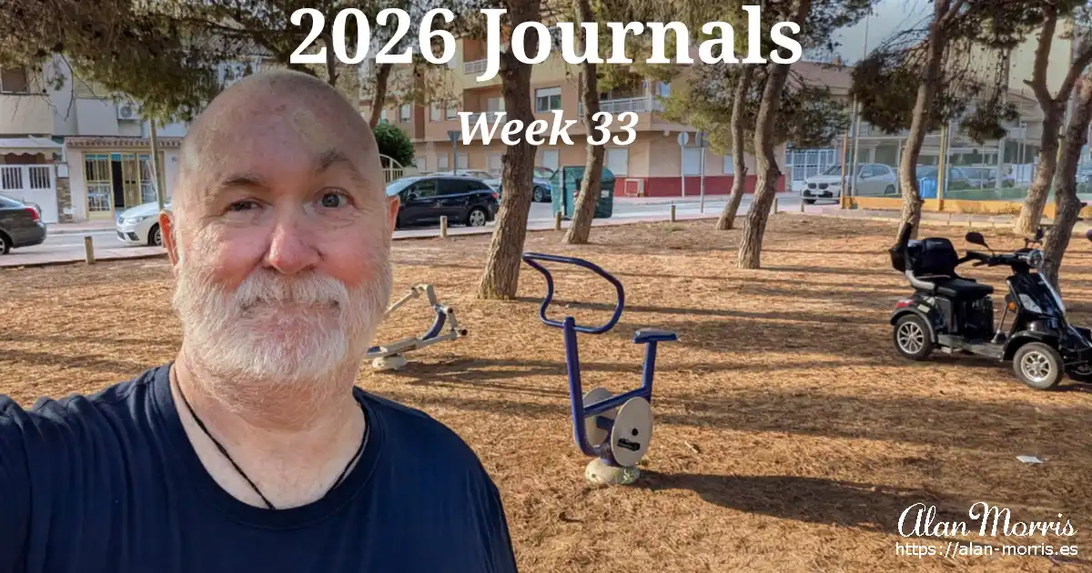 Alan Morris standing in a pine‑covered park area with outdoor gym equipment in Los Alcázares.