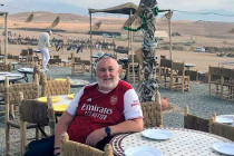 Alan Morris sat at a dining table in the Agafay desert.