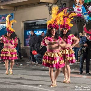 Men in coloured dresses, Aguilas Carnival.