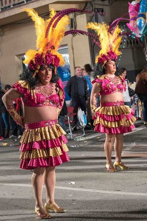 Men in coloured dresses, Aguilas Carnival.