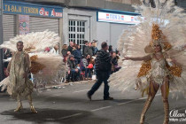 Performers in white feather costumes, Aguilas Carnival.