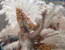 Lady in a white feather costume at Aguilas Carnival.