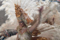 Lady in a white feather costume at Aguilas Carnival.