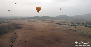 Air balloons are all around us us we float above the desert near Marrakech. Air balloons are all around us us we float above the desert near Marrakech.