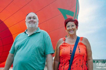 Alan Morris and Lisa Biles by the hot air balloon they went for a flight in.