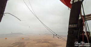 Lots of air balloons flying over the desert. Lots of air balloons flying over the desert.