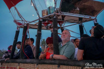 Lisa Biles and Alan Morrisin the basket of an air balloon.