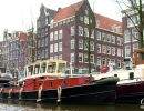 Canal boat on a canal running through Amsterdam.