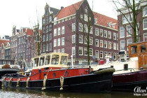 Canal boat on a canal running through Amsterdam.