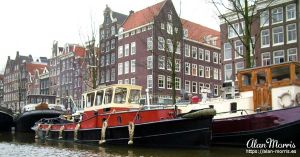 Canal boat on a canal running through Amsterdam.