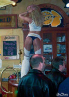 Waitress dancing on the bar at Teasers restaurant/bar in Amsterdam.