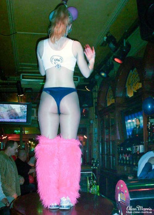 Waitress dancing on the bar at Teasers restaurant/bar in Amsterdam.