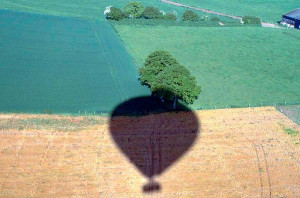 The shadow of the air balloon I am in as we come to land in a field in Hampshire. The shadow of the air balloon I am in as we come to land in a field in Hampshire.