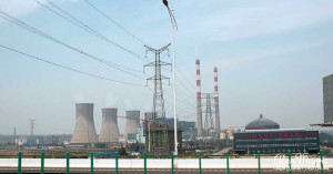 Power plant chimneys rise to the sky in Beijing. Power plant chimneys rise to the sky in Beijing.