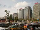 Heavy traffic & tall tower blocks in downtown Beijing.