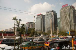 Heavy traffic & tall tower blocks in downtown Beijing.