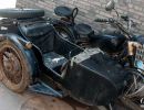 Motorbike & sidecar parked outside a home in the Beijing Hutongs.