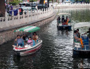 Boats on a canal that links different lakes in downtown Beijing.