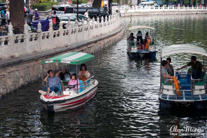 Boats on a canal that links different lakes in downtown Beijing.