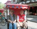 Mike Morris & Alan Morris on their tuk-tuk in Beijing.