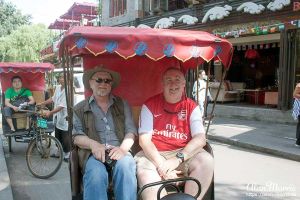 Mike Morris & Alan Morris on their tuk-tuk in Beijing.