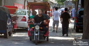 Tuk tuk on a street in the Beijing Hutongs.