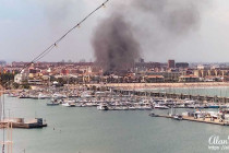 Black clouds rising from a fire near the port in Valencia.