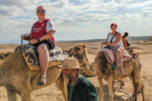 Alan Morris and Lisa Biles, on the camels they rode through the desert. Alan Morris and Lisa Biles, on the camels they rode through the desert.