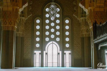 The sun shining threw a door inside the Hassan II Mosque in Casablanca.