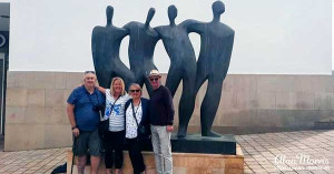 Friends stood beside the Monument to Solidarity in Ceuta.