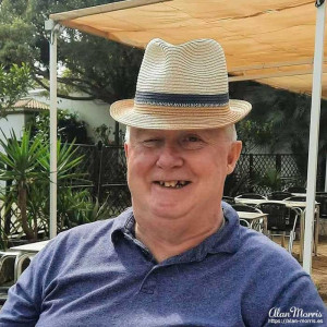 Alan Morris wearing Tony Luton's hat outside a restaurant in Ceuta.