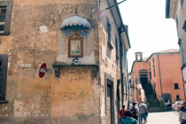 Memorial for the Virgin Mary on the side of a home in Civita di Bagnoregio.