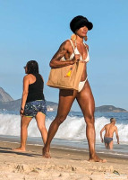 Ladies walking along Copacabana Beach.