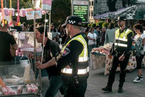 Police following a sweet stall.