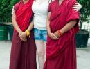 Sarah Anderson & two monks outside the Forbidden City.