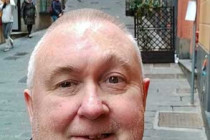 Alan Morris standing in the Salita del Prione in Genoa.