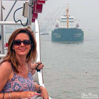 Liz Conroy on a boat, cruising up the Huangpu River in Shanghai. Liz Conroy on a boat, cruising up the Huangpu River in Shanghai.