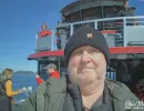 Alan Morris on the deck of the small boat in Alaska.