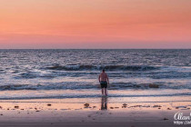 Alan Morris walking into the Atlantic Ocean at sunrise, Jekyll Island, Georgia.