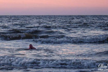 Alan Morris swimming in the Atlantic Ocean at sunrise, Jekyll Island, Georgia.