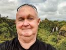 Alan Morris in front of Opaekaa Falls.