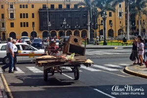A bicycle and cart being used to transport old furniture. A bicycle and cart being used to transport old furniture.