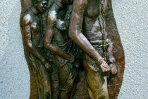 Monument in Denver City Park, chained slaves.