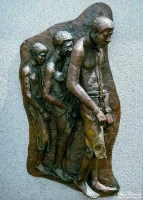 Monument in Denver City Park, chained slaves.
