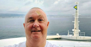 Alan Morris on the balcony of his cabin on the Costa Toscana