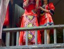 The bride appears on the balcony to choose her husband.