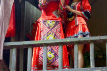 The bride appears on the balcony to choose her husband.