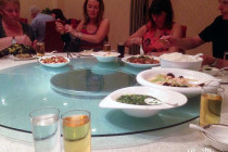 Food, being served up on a lazy Susan in a Sichuan restaurant.