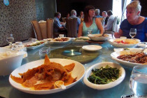 Food, being served up on a lazy Susan in a Sichuan restaurant.