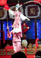 Puppeteer performing in the Sichuan Opera & Folk Arts show. Puppeteer performing in the Sichuan Opera & Folk Arts show.